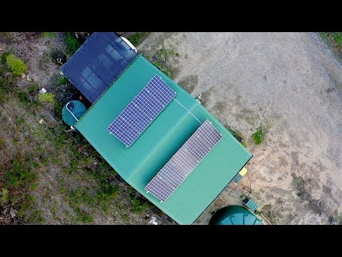 How did higher quality equipment help improve the performance of an off-grid solar power system?