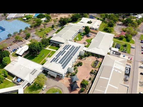 What are the environmental and financial benefits of solar power at Palmerston College?